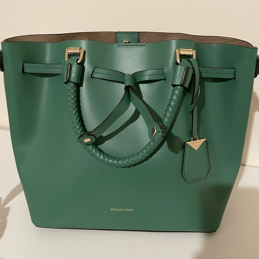 A nice Michael Kors bag in green nice color